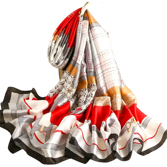 Crimson Metrocharm Oblong Satin Silk-Feel Scarf with beautiful mix of colors, lines, geometric shapes, and belt designs. Black trim with a mix of red, gray, cream, and mustard. 