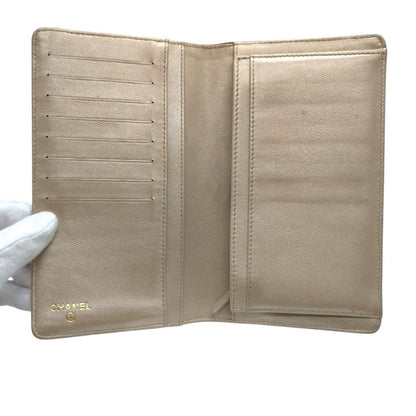 CHANEL Pink Camellia Embossed Long Bifold Leather Wallet