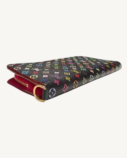 Angled exterior view of the black Multicolore Insolite wallet showing folded canvas edge and gold-tone D-ring.