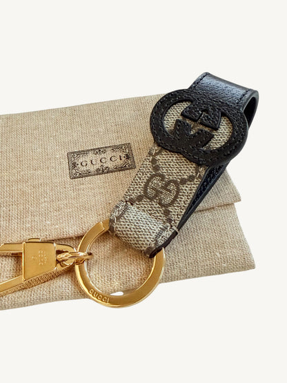 Gucci Interlocking G Key Ring Bag Charm — front view showing embossed oval Interlocking G emblem | Shimmer & Shawls