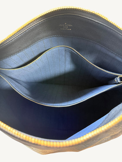 Louis Vuitton Audacieuse MM Infini — interior open showing blue striped canvas lining and gold-tone interior zipper pocket