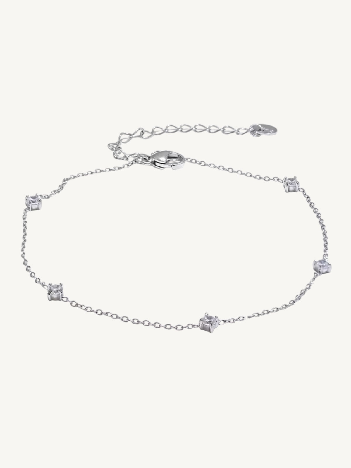 The Étoile silver CZ station anklet on white background — Shimmer & Shawls