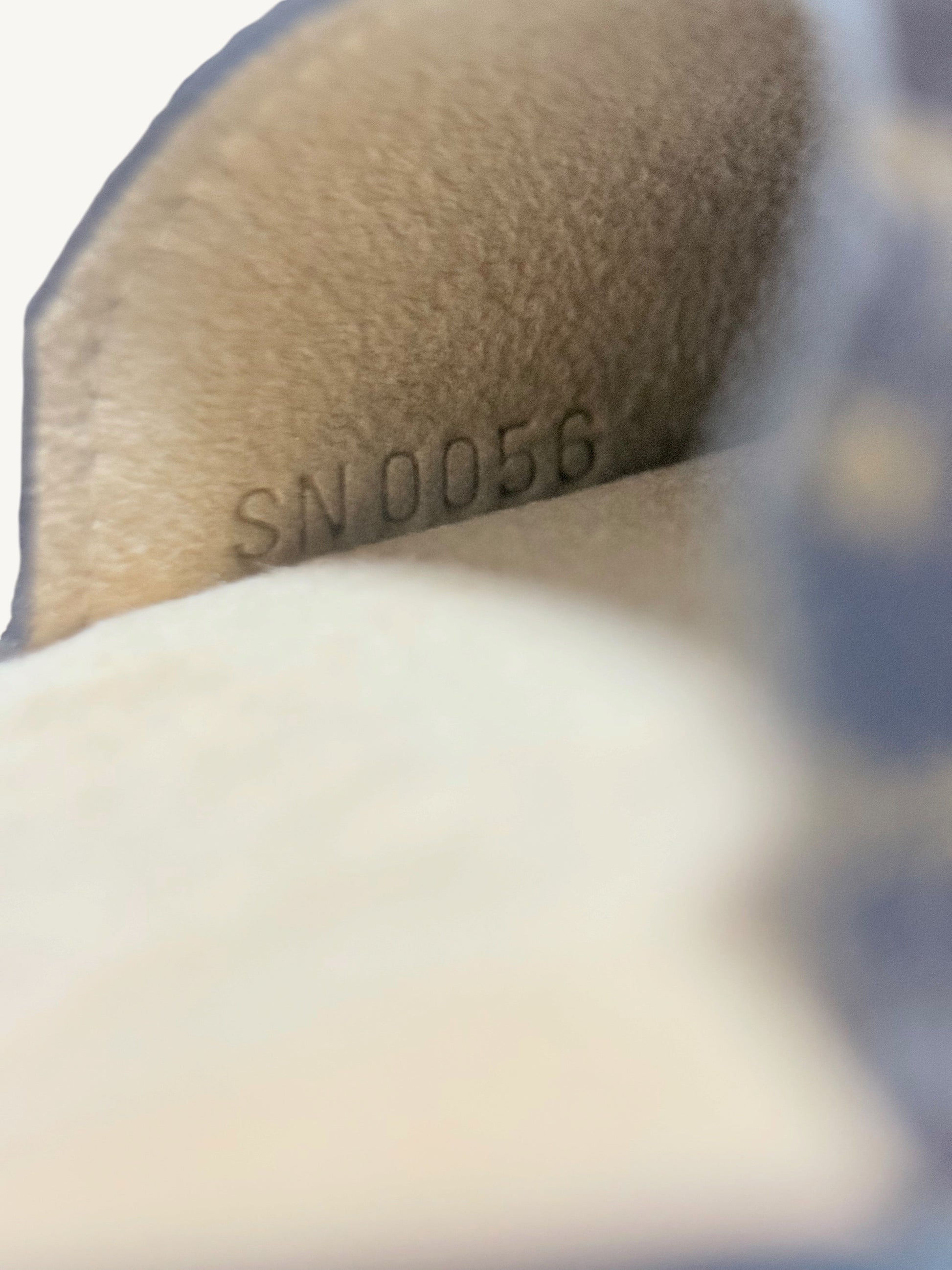 Louis Vuitton Monogram Étui Stylo Pen Case — close-up of SN0056 date code stamp confirming May 2006 production | Shimmer & Shawls
