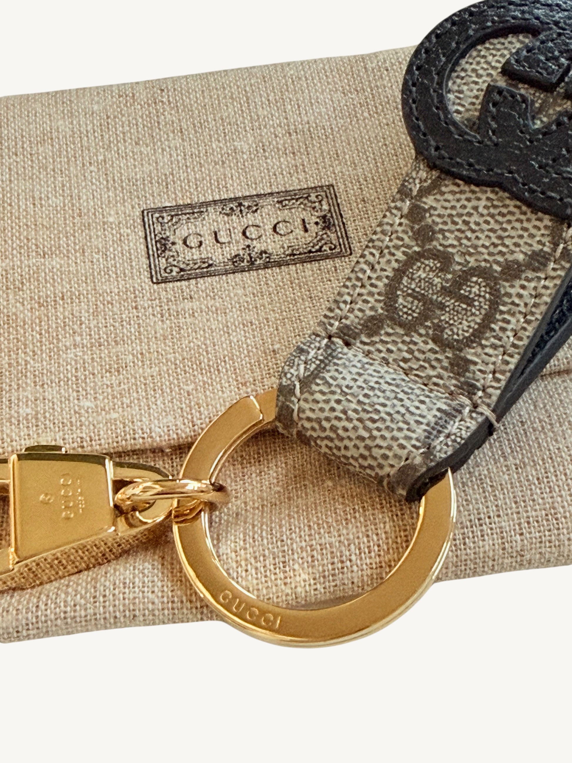 Gucci Interlocking G Key Ring Bag Charm — full front view on white background showing GG Supreme strap | Shimmer & Shawls