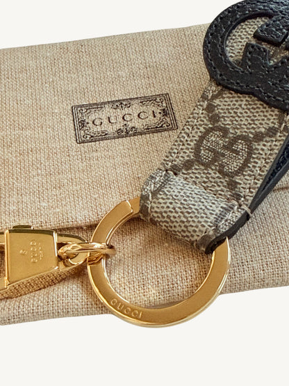 Gucci Interlocking G Key Ring Bag Charm — full front view on white background showing GG Supreme strap | Shimmer & Shawls