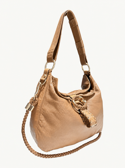 A brown leather shoulder bag with a braided strap and a decorative woven leather detail on the front, shown against a plain off-white background.
