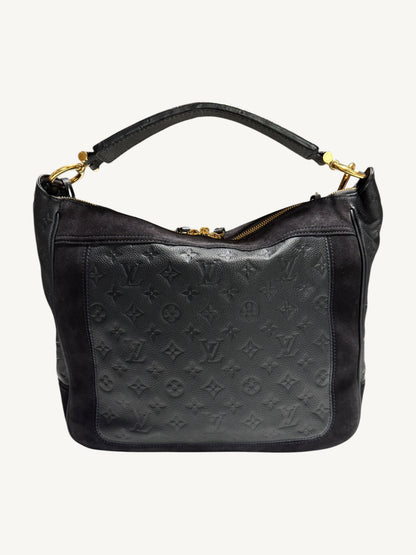 Louis Vuitton Audacieuse MM Infini — back view showing monogram empreinte leather, suede side panels, flat leather top handle and gold-tone zipper pulls

