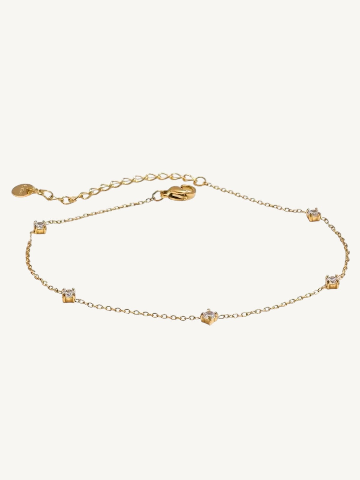 The Étoile gold CZ station anklet on white background — Shimmer & Shawls