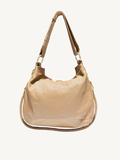 A camel brown Gucci leather hobo shoulder bag with a matching leather strap and a braided chain detail, shown against a plain off-white background.