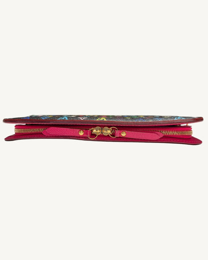 Side profile of the Louis Vuitton Insolite wallet showing two gold-tone zipper pulls with pink leather tabs.