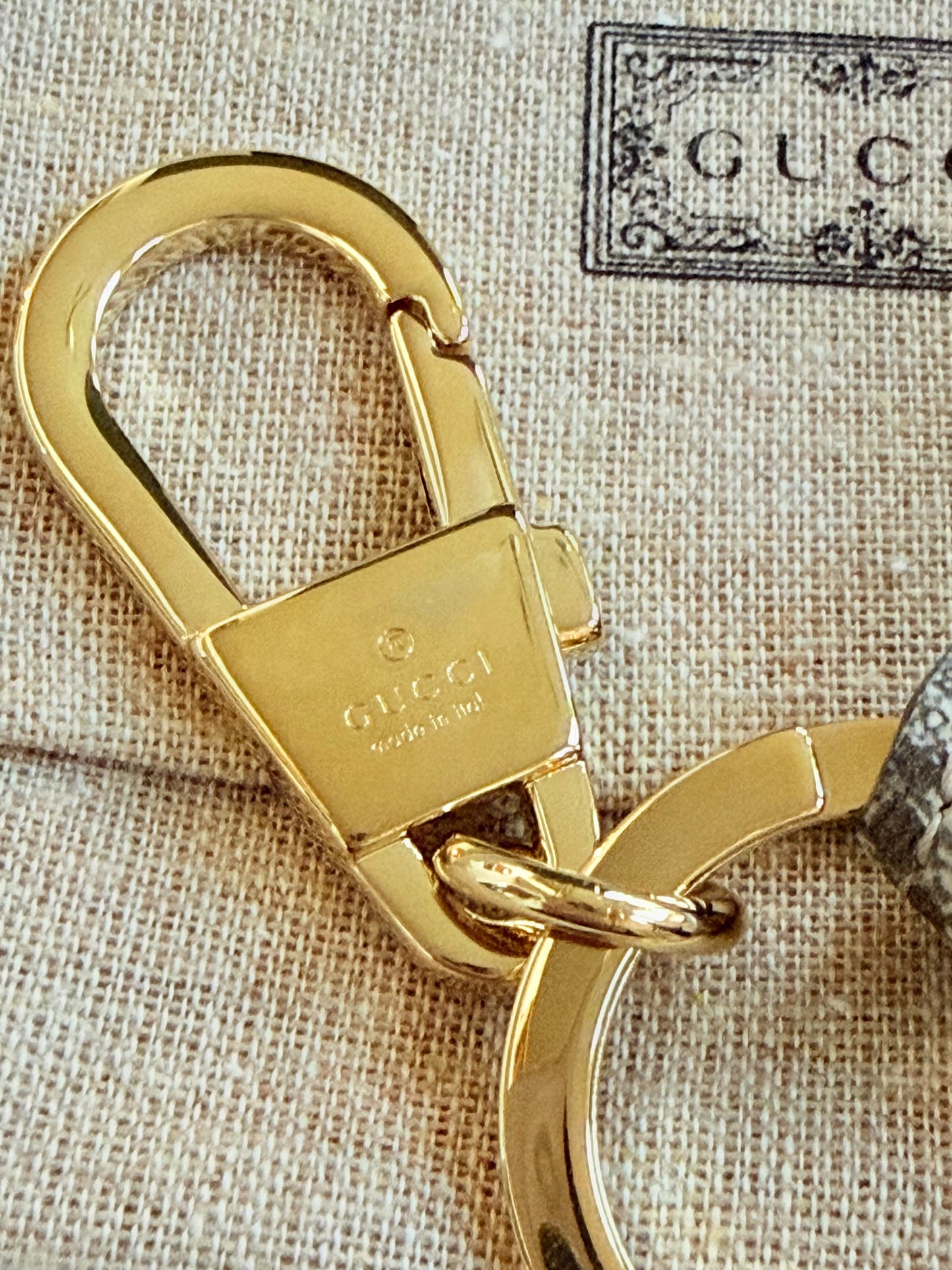 Gucci Interlocking G Key Ring Bag Charm — in Gucci box angled view showing full boutique presentation | Shimmer & Shawls