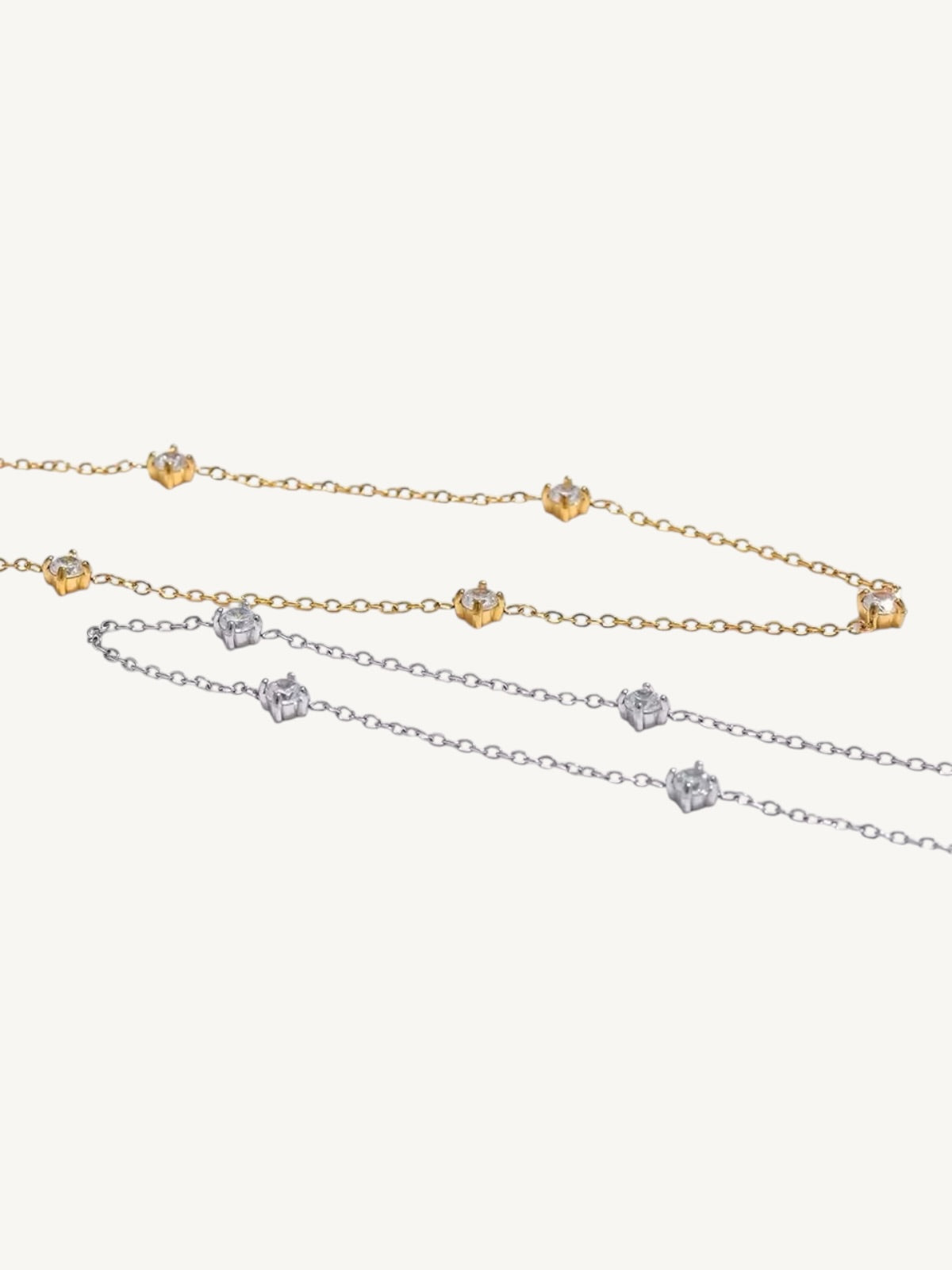 The Étoile gold and silver CZ station anklets side by side — Shimmer & Shawls