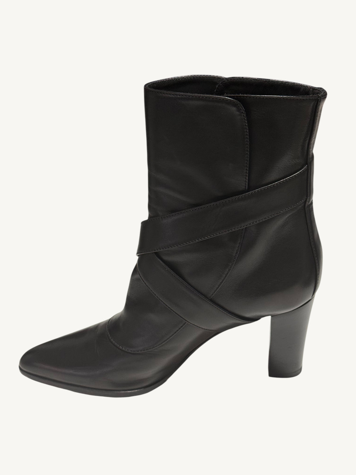 Side profile of a black Louis Vuitton ankle boot, showing crossed leather straps and a block heel.