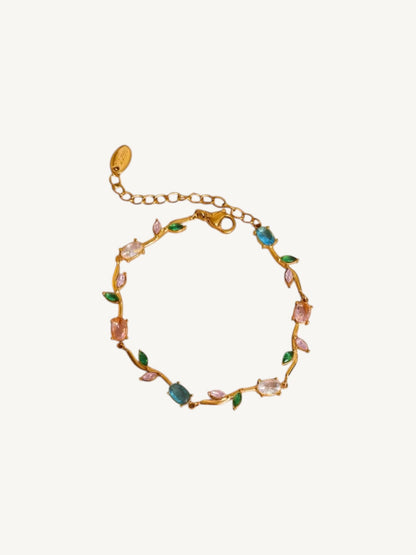 The Printemps multicolor CZ vine bracelet flat lay on white — Shimmer & Shawls