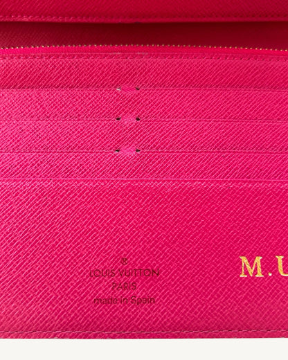 Louis Vuitton Paris Made in Spain stamp beside gold-foil M.U initials on Grenade pink leather.