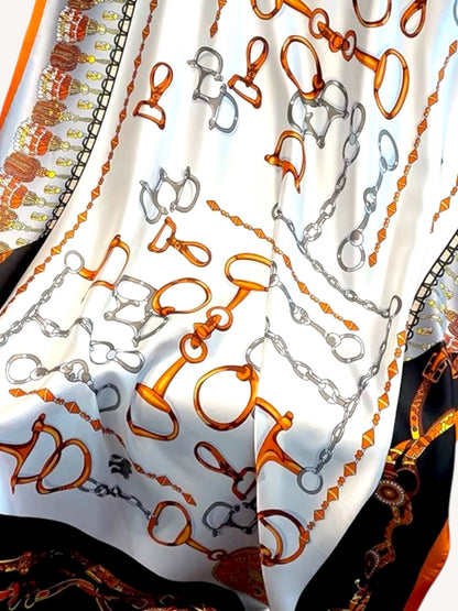 The Deauville – close up of equestrian hardware bits and stirrups in burnt orange and silver