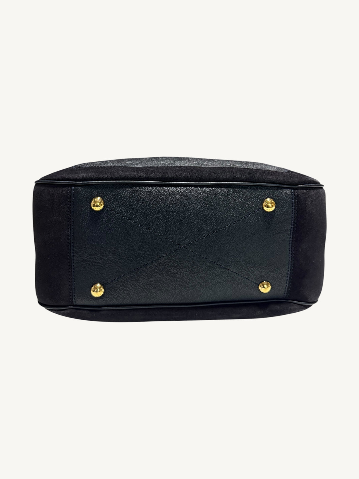Photo 6 — Louis Vuitton Audacieuse MM Infini — bottom view showing four gold-tone protective feet and base leather panel