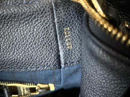 Louis Vuitton Audacieuse MM Infini — close-up of date code AR1102 stamped in gold on interior leather tab confirming Made in France 2012


