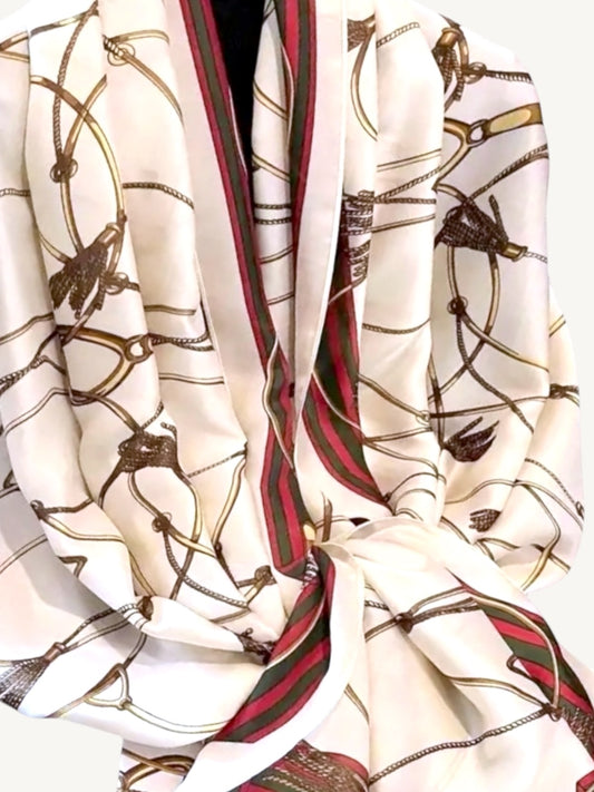 The Matera – ivory silky satin scarf shawl wrap showing full equestrian print with red and green striped border, draped on white background