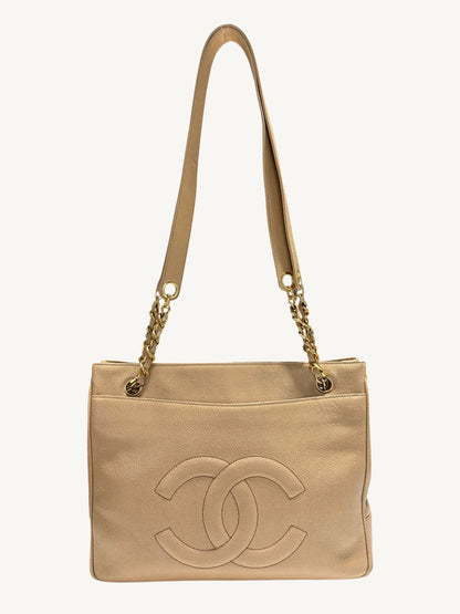 Front view of Chanel vintage beige caviar leather CC tote with gold-tone chain shoulder straps