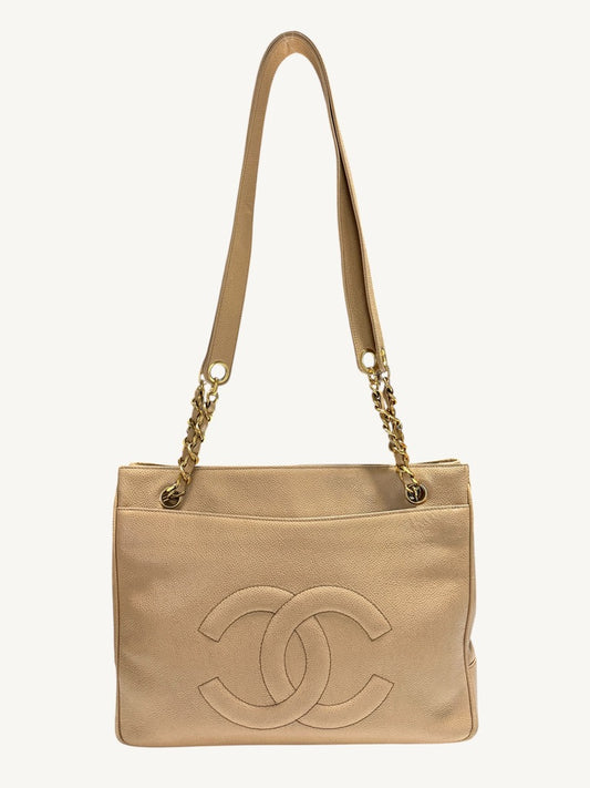 Front view of Chanel vintage beige caviar leather CC tote with gold-tone chain shoulder straps