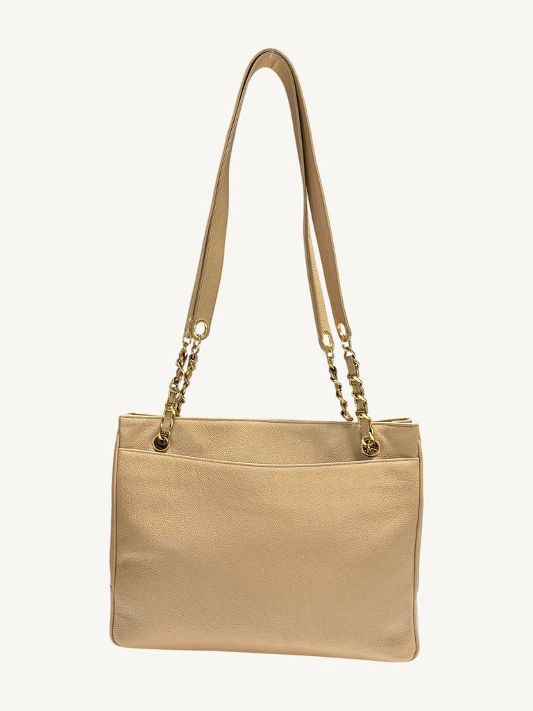 Full rear view of Chanel caviar leather tote with full-width open slip pocket