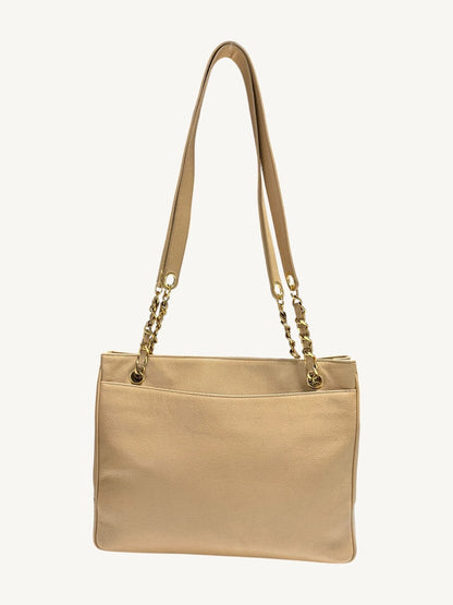 Full rear view of Chanel caviar leather tote with full-width open slip pocket
