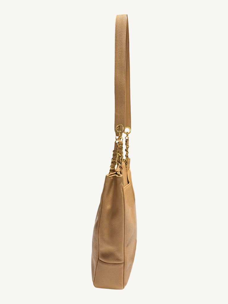 Opposite side profile showing soft folds in the beige caviar leather gusset