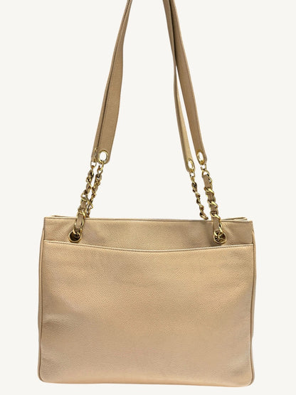 Closer rear panel view showing pebble-grain leather and open pocket edge