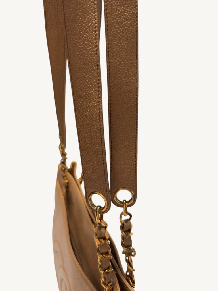 Wide caviar leather shoulder sections with stitching and gold-tone grommets