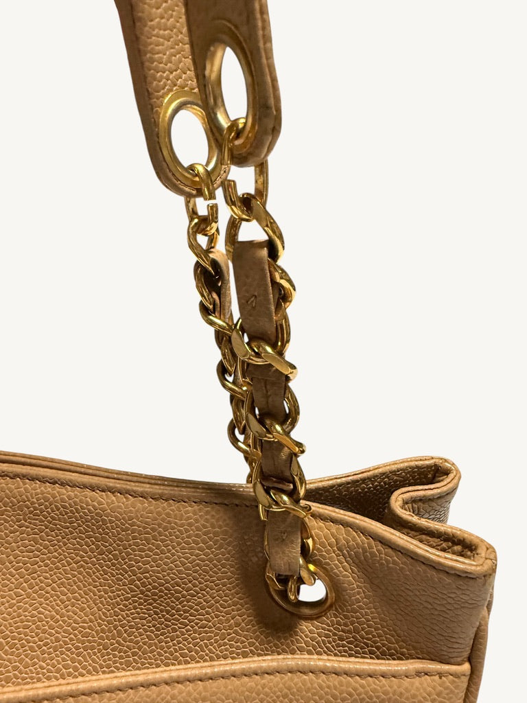 Chain strap close-up showing leather weave and side attachment ring