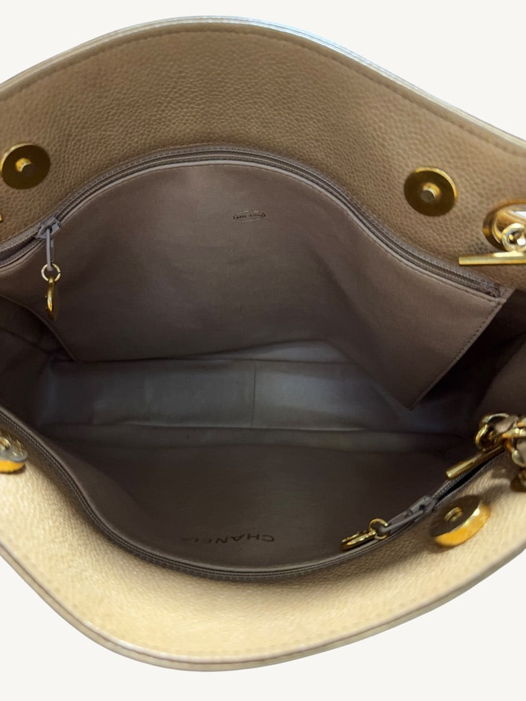 Open main compartment showing all-leather interior, two zip pockets and magnetic snaps