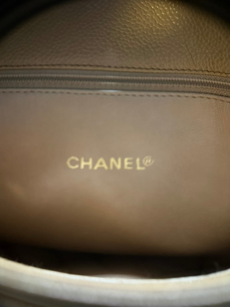 Gold CHANEL interior stamp beneath the zippered pocket