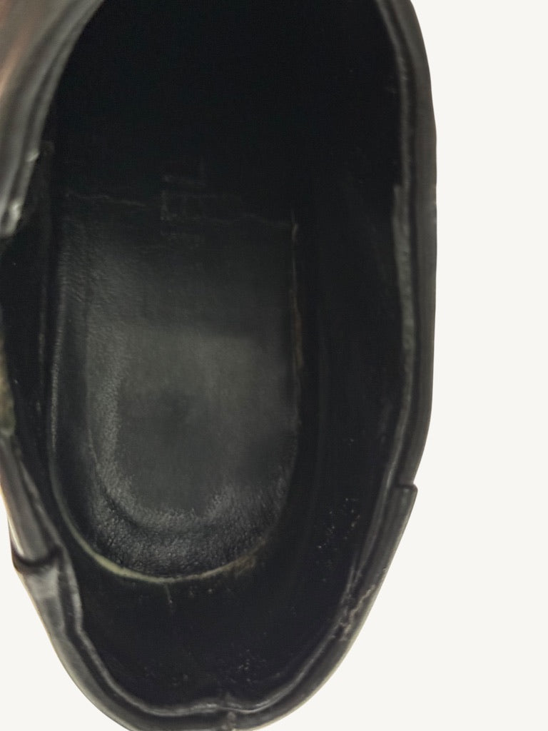 Interior footbed view of Chanel vintage black ankle boots documenting lining condition