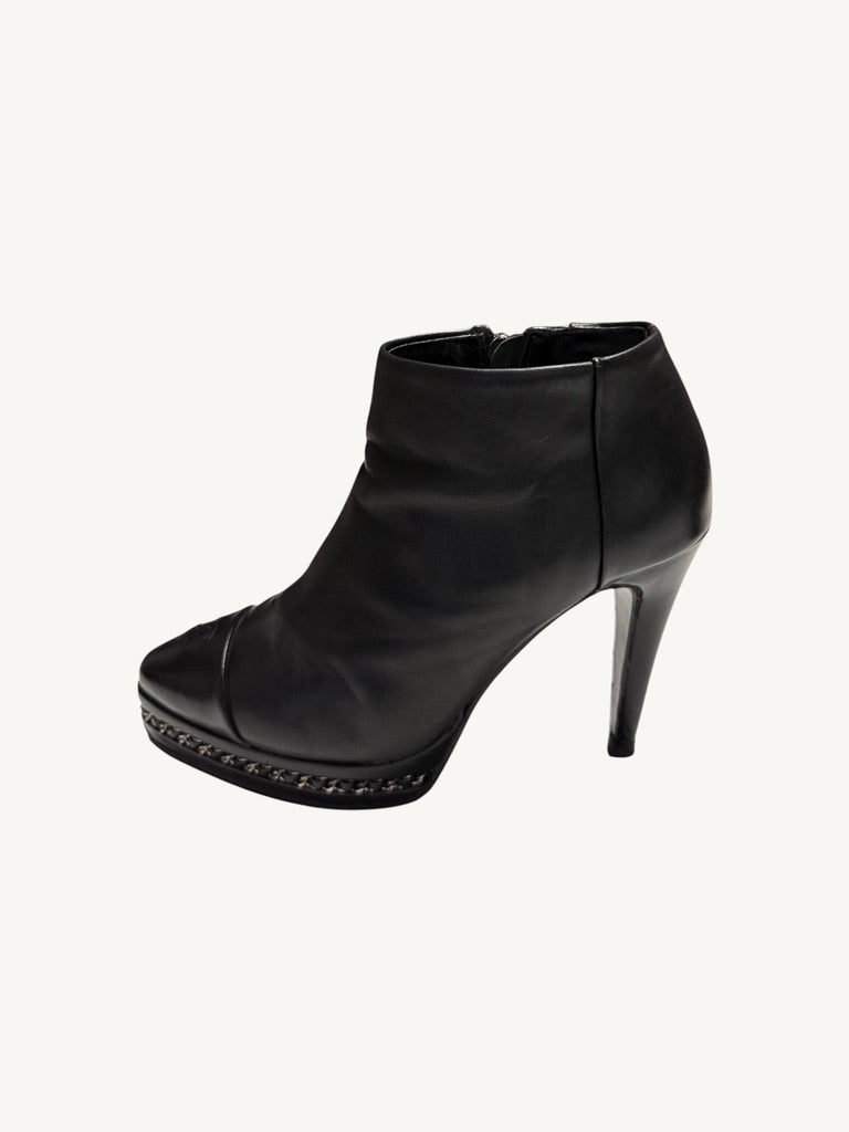 Opposite outer profile of Chanel vintage black calfskin chain platform stiletto ankle boot
