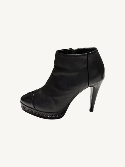 Opposite outer profile of Chanel vintage black calfskin chain platform stiletto ankle boot