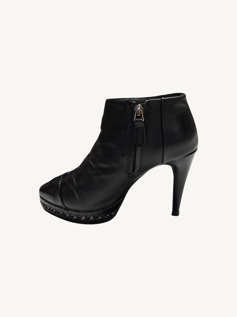Opposite zipper-side profile of Chanel vintage black calfskin chain platform ankle boot