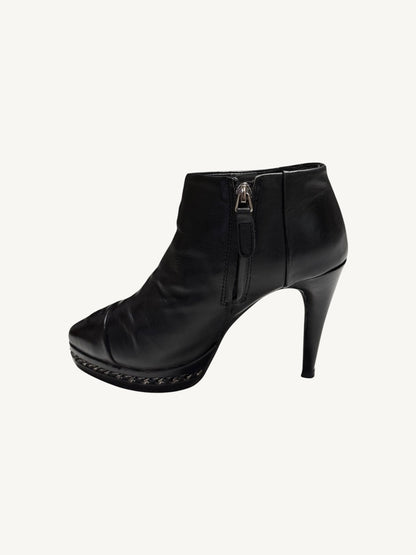 Opposite zipper-side profile of Chanel vintage black calfskin chain platform ankle boot