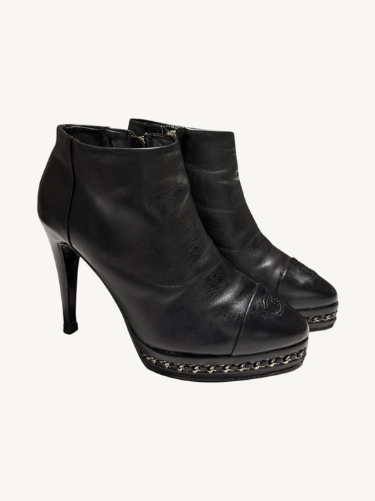 Chanel vintage black calfskin chain platform ankle boots, pair shown from a front three-quarter angle