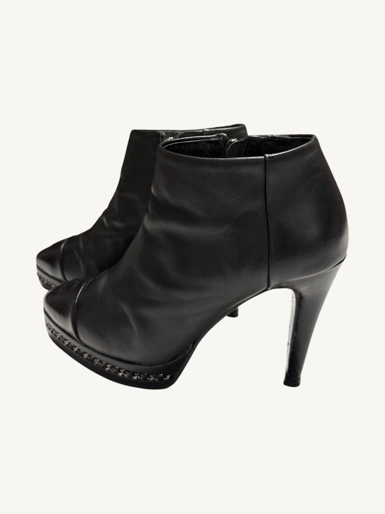 Chanel vintage black calfskin chain platform ankle boots, pair shown from opposite outer angle