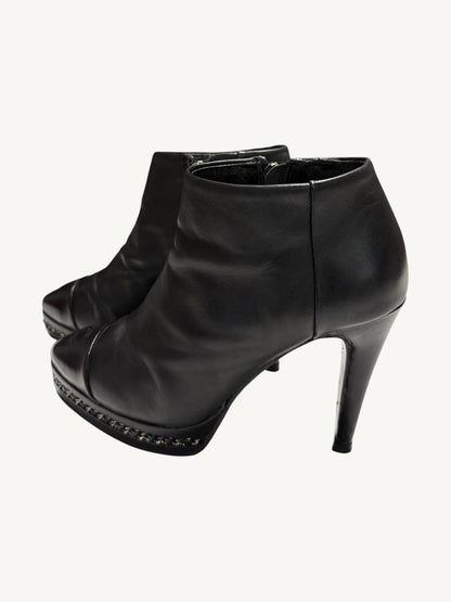 Chanel vintage black calfskin chain platform ankle boots, pair shown from opposite outer angle