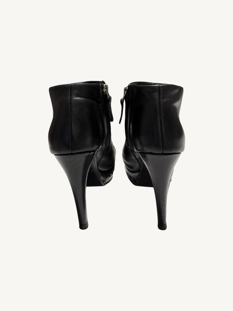 Rear view of Chanel vintage black calfskin platform ankle boots with stiletto heels
