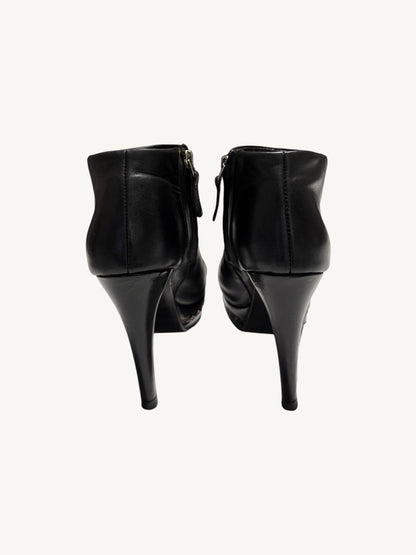 Rear view of Chanel vintage black calfskin platform ankle boots with stiletto heels