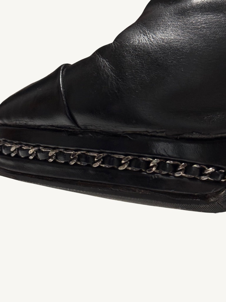 Close-up of Chanel vintage ankle boot chain platform trim and protective sole edge