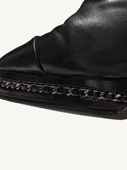 Close-up of Chanel vintage ankle boot chain platform trim and protective sole edge
