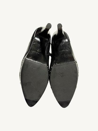 Outsoles of Chanel vintage platform ankle boots showing protective textured rubber half-soles