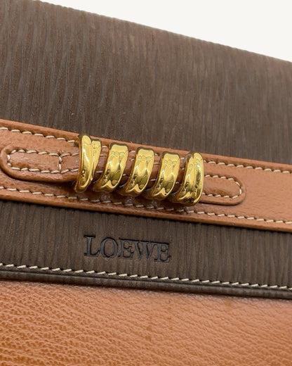 Gold-tone twisted-ring hardware and embossed Loewe logo