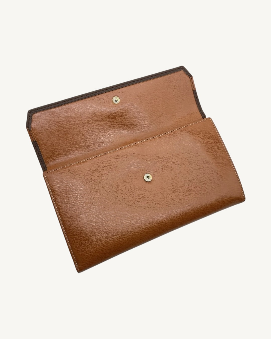 Open snap-button flap and leather exterior