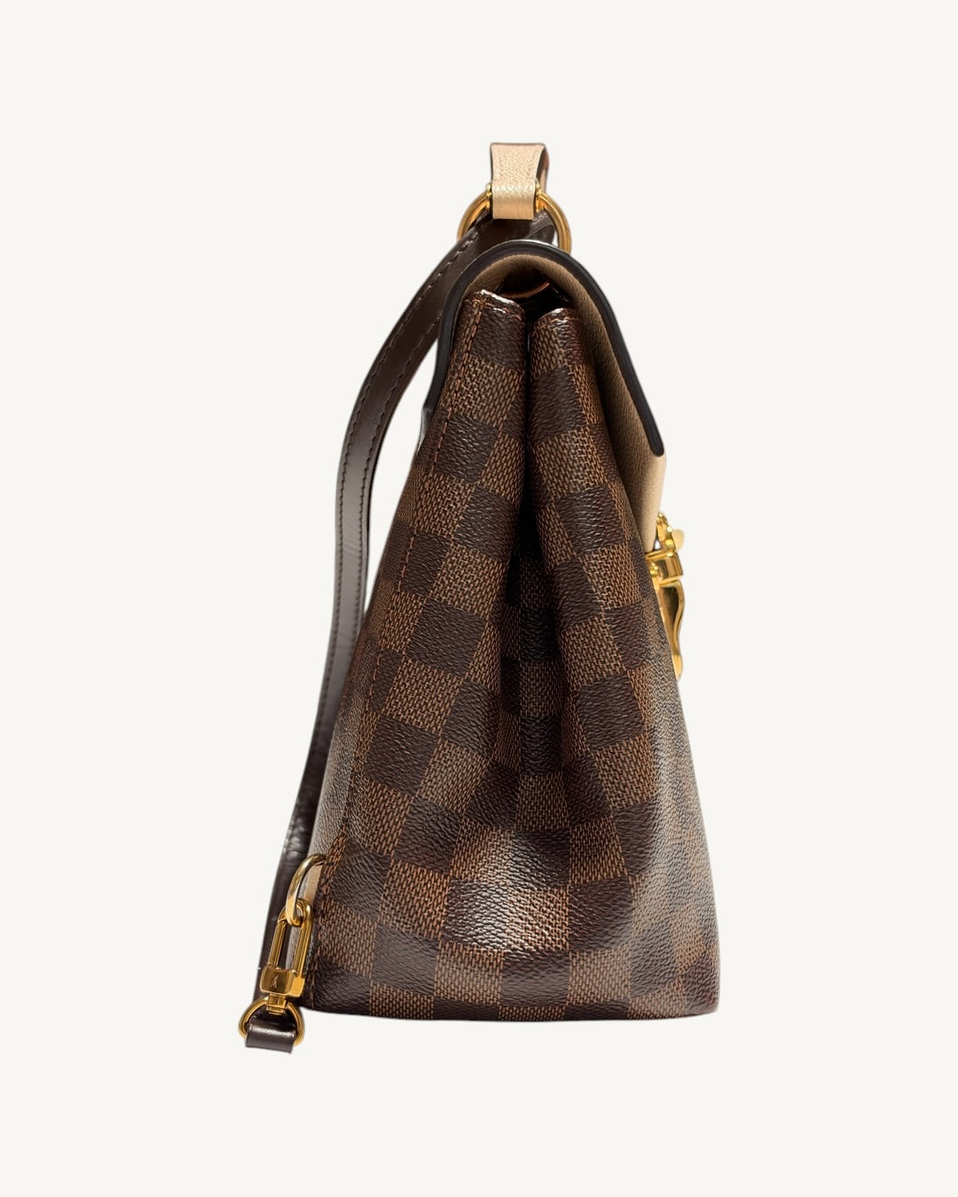 Louis Vuitton Clapton Backpack — Side profile showing folded canvas gusset and strap attachment