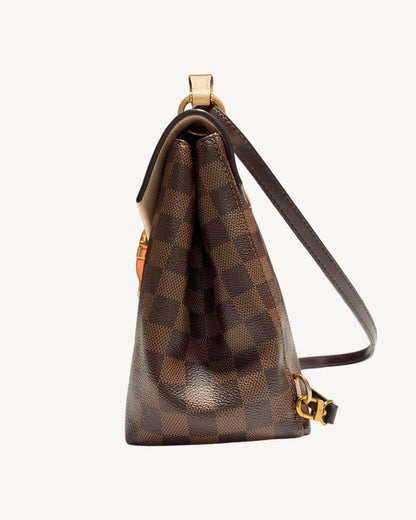 Louis Vuitton Clapton Backpack — Opposite side profile showing canvas gusset and gold-tone swivel clasp
